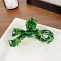 Elegant green marbled acetate bow hair claw clip for women on a white display tray - 10CM (Large) / Dark Green