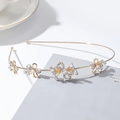 Détail du serre-tête papillon doré avec des strass en cristal et des perles blanches - Nœud 6#
