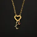 Elegant gold heart clasp necklace with letter K charm and pink gem, stainless steel. - Letter X