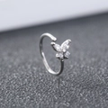 Silver clip-on nose ring with crystal butterfly detail and polished metal finish - Butterfly Cluster (SE1489)