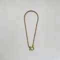 Detailed macro view of 18K gold plated wheat chain with horseshoe shackle clasp closure - Full Gold Color