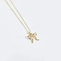 Élégant collier doré avec pendentif nœud au design minimaliste et chaîne fine - Nœud Doré