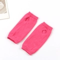 Knitted bright pink fingerless arm warmers with thumb holes on a clean white background - One Size / Rose Red