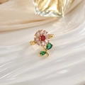 Close-up of golden floral ring with colorful zircon petals on white porcelain base - JZ0105-Gold Multicolor Gemstone Flower