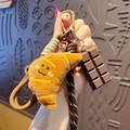 Cute pretzel bread plush keychain with brown woven strap and chocolate charm - Plush Food-Croissant + Chocolate