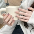 Detail of nude press-on nails with silver fluid texture and purple gemstone accents - Nude Pink Silver Liquid Metal Rhinestone Style (BY1368) / Phototherapy Glue Style
