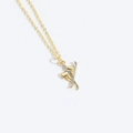 Minimalist gold ski boots and silver skis pendant necklace on a delicate gold chain - Ski