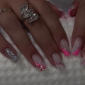 Macro detail of French pink gradient press-on nails with leopard patterns and silver glitter - Pink Leopard Print Lines