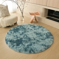 Plush round area rug with teal gradient finish on a minimalist wooden floor - Tie-Dye Gray Blue