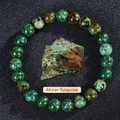 Beaded natural African Turquoise stone bracelet with raw gemstone on black background - African Pine Stone