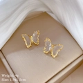 Elegante gouden vlinder oorknopjes met heldere kristallen en sprankelende inzetstukken - F410 Transparante Vlinder Oorknopjes (Zilveren Pin Koperen Vergulding)