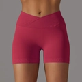 Detail view of high-waist yoga shorts featuring a V-shaped criss-cross ribbed waistband - S / Bottoms / Red