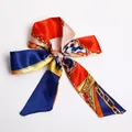 Red and blue silk ribbon scarf with golden chain pattern tied in a bow shape - S42-Red Blue Contrast Chain