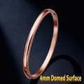 4mm domed lucky clover stainless steel bangle in rose gold finish with mirror polish - Outer Arc (40-A-5) / 4mm Width / Rose Gold