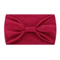 Detail of burgundy elastic headband showing knot design and soft knit texture - Dark Red