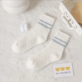 White coral fleece socks with light blue stripes on soft white carpet background - White with Two Stripes
