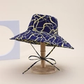 Double-sided sun hat in navy blue with yellow abstract lines and matching bow tie strap - S-Shaped Line Style / Navy Blue