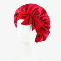 Red satin sleeping bonnet featuring a large bow and elastic band for hair protection - One Size / Red