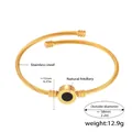 Dettaglio del bracciale a torsione in acciaio inossidabile placcato oro 18k con conchiglia - Corda Intrecciata Oro Conchiglia Nera (Z394-5.8CM)