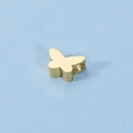 Close-up of golden butterfly pendant bead with smooth mirror finish and hole detail - 18K Gold
