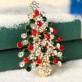Sparkling Christmas tree brooch with red and green rhinestones on gold alloy base - Hollow Christmas Tree Charm