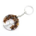 Handmade silver wire tree of life keychain with Tiger Eye crystal stones on white surface - Round Tiger Eye