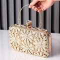 Elegant gold evening clutch bag featuring floral rhinestone patterns and metal handle - Gold