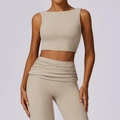 Beige two-piece high-waist yoga set with sleeveless crop top and pleated leggings - S / Flaxen