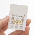 Gold stainless steel necklace with 666 angel number pendant on a decorative display card - Cutout 666 / Gold