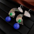 Macro detail of geometric silver spiral earrings with green and purple beads - Silver Spiral Ear Hook