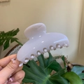 Close-up of a white glossy claw clip featuring a streamlined crescent shape for women - 10cm Yuanbao Claw / Grey/White