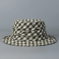 Detailed view of a green and white plaid cotton linen bucket hat for sun protection. - M (56-58cm) / Green