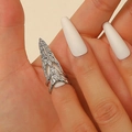 Detailed close-up of a silver armor ring with crystals on a hand in a macro view - Silver Pave Long Armor Ring (WG1-0227)
