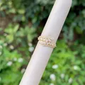 Detailed view of adjustable 18K gold plated wheat leaf ring with sparkling zircons - Wrapped Feather Style