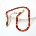 Elegant gold necklace with pave-set red rectangular crystals and adjustable chain link - Red