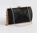 Luxurious black satin evening clutch with gold fringe tassels and woven texture - Black