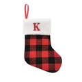 Detail of red and black buffalo plaid Christmas stocking with white faux fur and letter K - Letter K