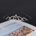 Detailed view of silver crystal bridal crown with heart patterns and sparkling rhinestones - Style SY-020