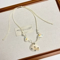 Detail of bohemian woven beige cord necklace with natural shell and faux pearl charms - White Shell Necklace H-83