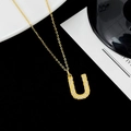Elegant gold U-shaped letter pendant necklace with sparkling micro-pave gemstones - Letter U