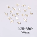 Detailed view of mini golden star nail art charms with size 5x7mm and MZH-A509 item code - Gold Starburst Shape (A509)