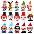 Set of 15 Christmas wind-up toys including Santa, reindeer and penguins on white background - Christmas Series 15pcs Set A