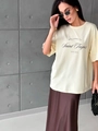 Loose beige Saint Tropez print cotton T-shirt paired with chocolate satin skirt - S / Apricot