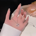 Collana minimalista d'argento con ciondolo a cuore e fiocco in acciaio titanio - Argento (Cuore Fiocco)