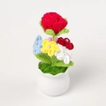 Macro detail of handmade crochet flower bouquet in white ceramic pot with pearls - Red Bubble Rose Potted Plant
