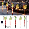 Solar Grinch Christmas ground lights with 5 stakes and warm glow for garden decor - Grinch (Red Tube)