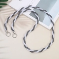 Detail of black and white double-strand woven phone strap with metal ring clasps - Black and White