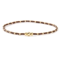 Detail of handcrafted brown beaded bracelet with polished gold accents on white background - Brown