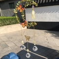 Macro shot of crescent moon wind chime with gold leaves, crystal balls and monarch butterflies - Star Gold Green Leaf - Citrine