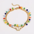 Detail of handmade beaded anklet with colorful beads and shell-like butterfly charm - Bracelet